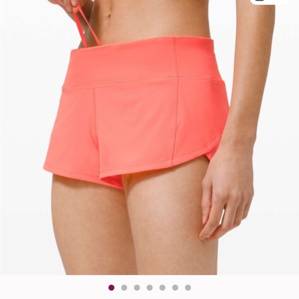 Lululemon Athletica Bright Coral Athletic Shorts.
